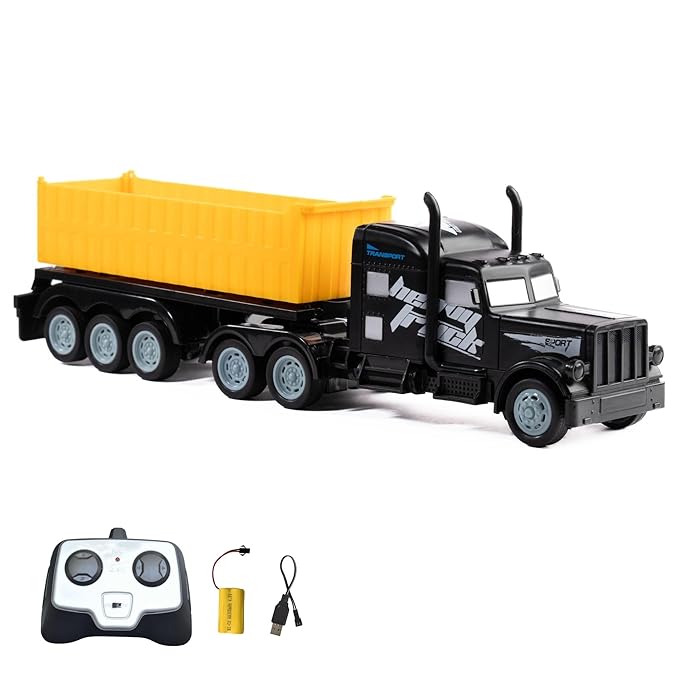 Black RC dump truck with yellow bed and black body, accompanied by a remote control and battery pack on a white background.