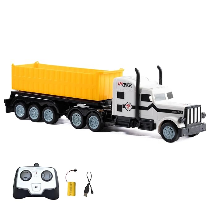 White RC dump truck with remote control and batteries on a white background