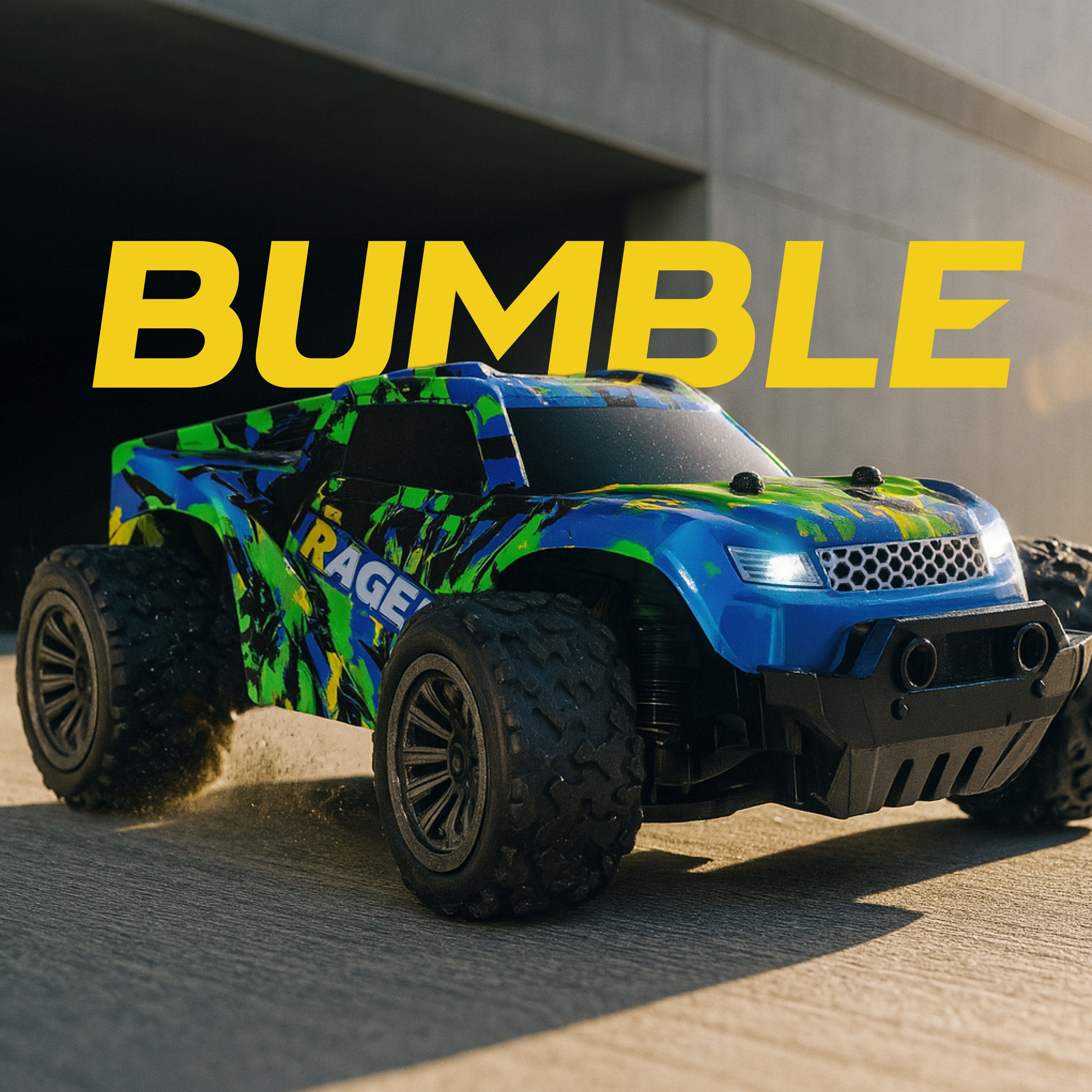 Colorful RC monster truck with 'RAGE' branding on a concrete surface, featuring the word 'BUMBLE' in large yellow letters above.