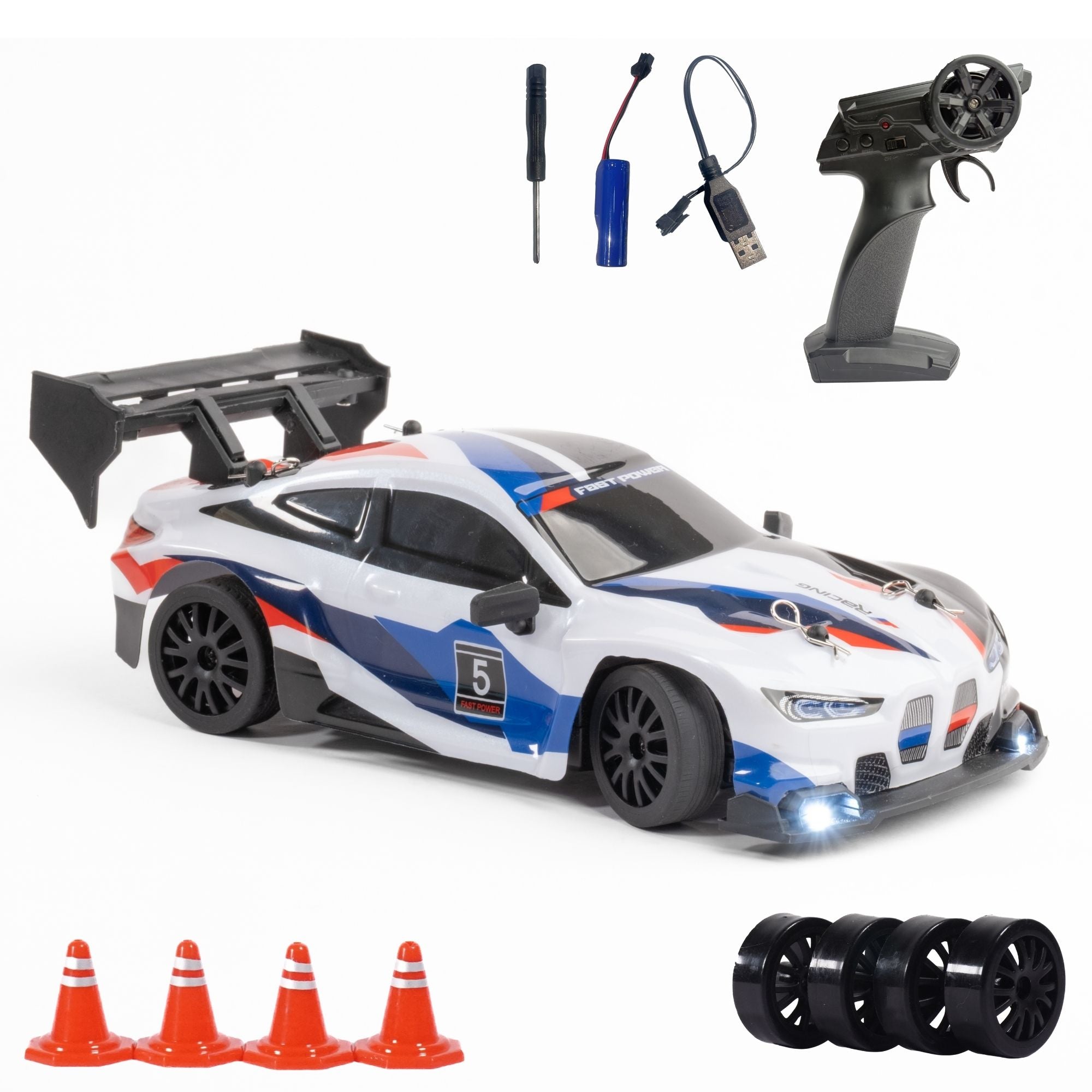 Toy race car with remote control, accessories, and traffic cones on a white background