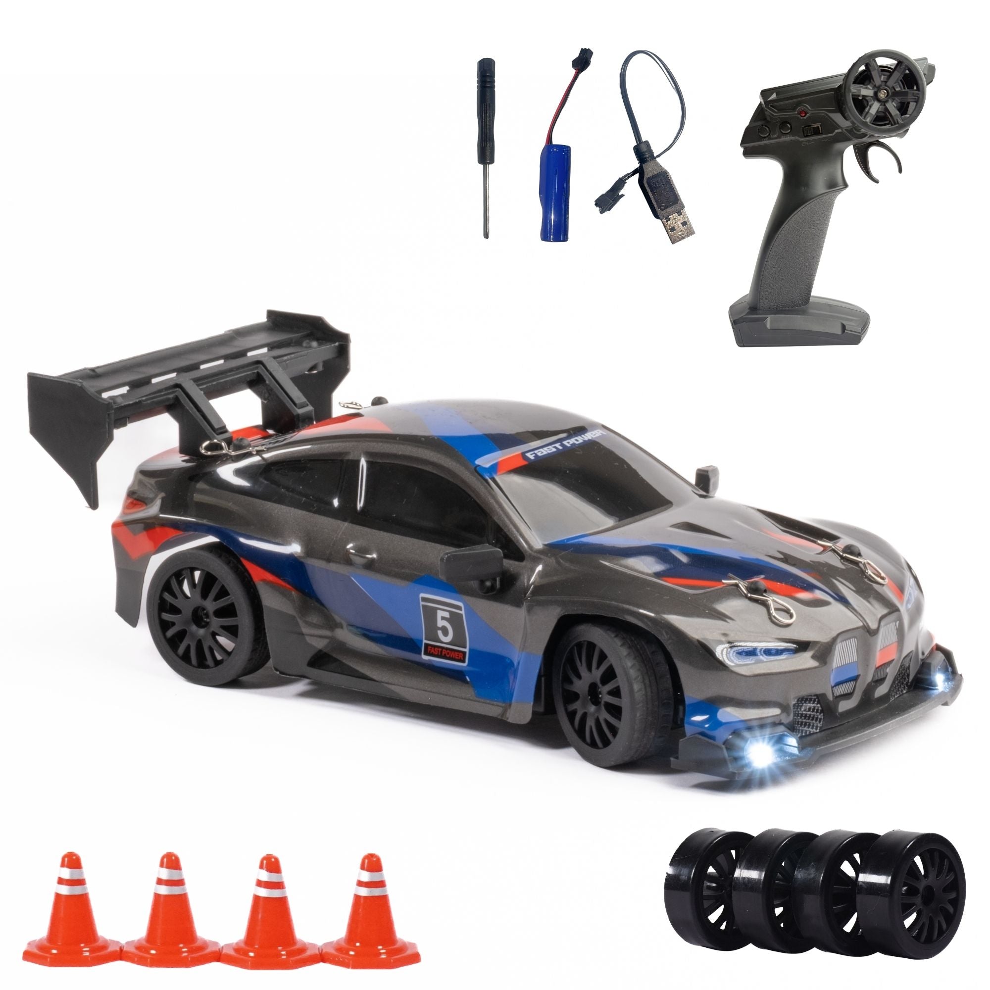 Toy RC race car with remote control, accessories, and cones on a white background