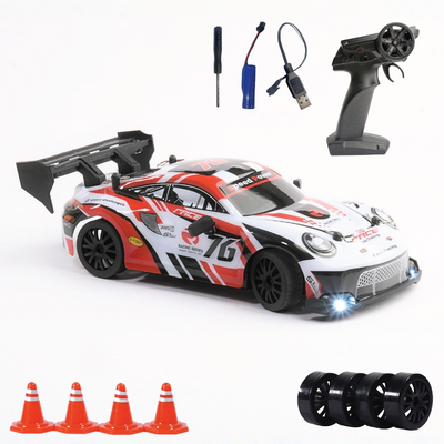 RC car with remote control, connectors, and traffic cones on a white background