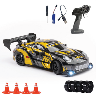 RC race car with remote control, connectors, and cones on a white background