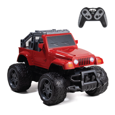 Red RC car with large black tires and a remote control on a white background
