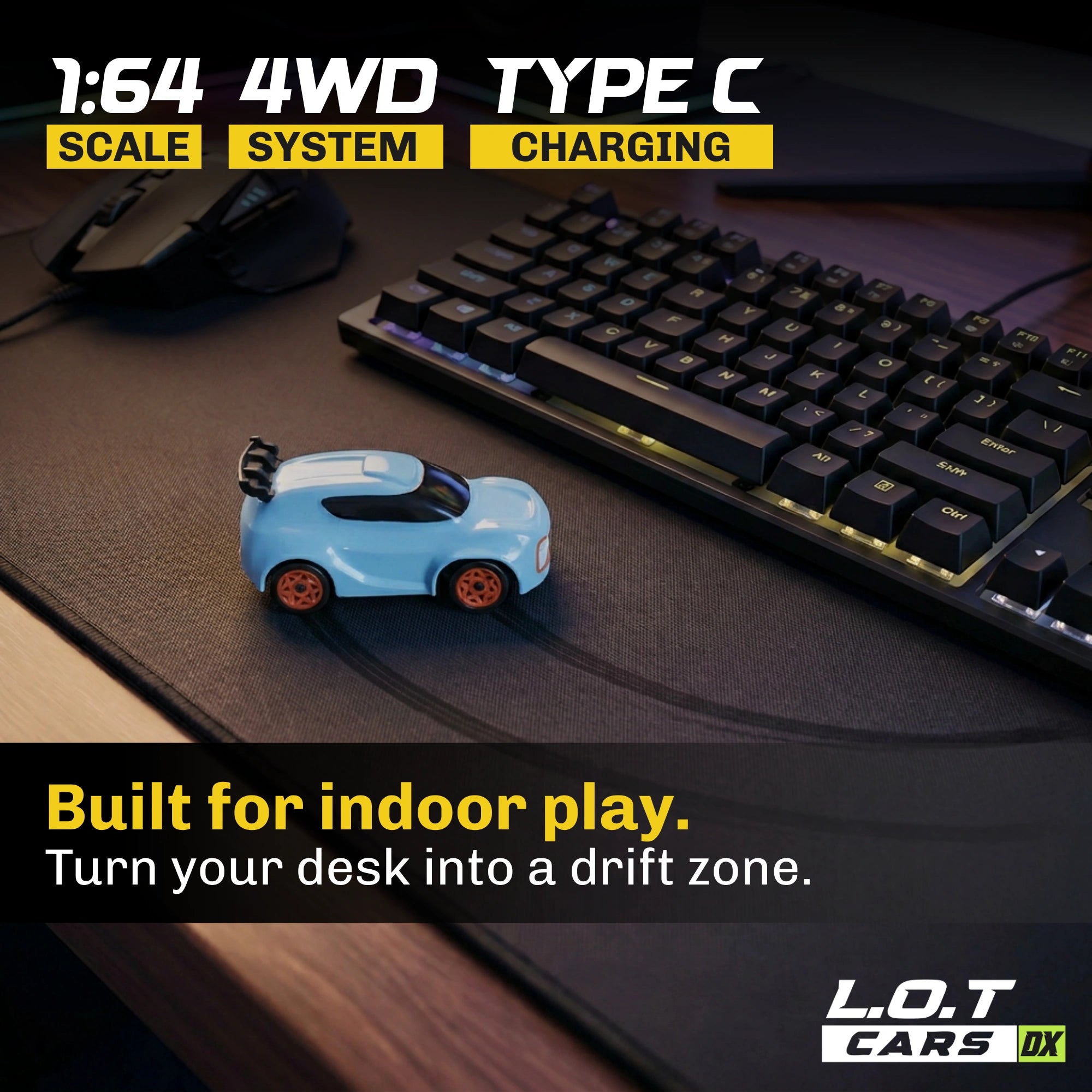 Small blue RC car on a desk with a keyboard, mouse, and text about its features.