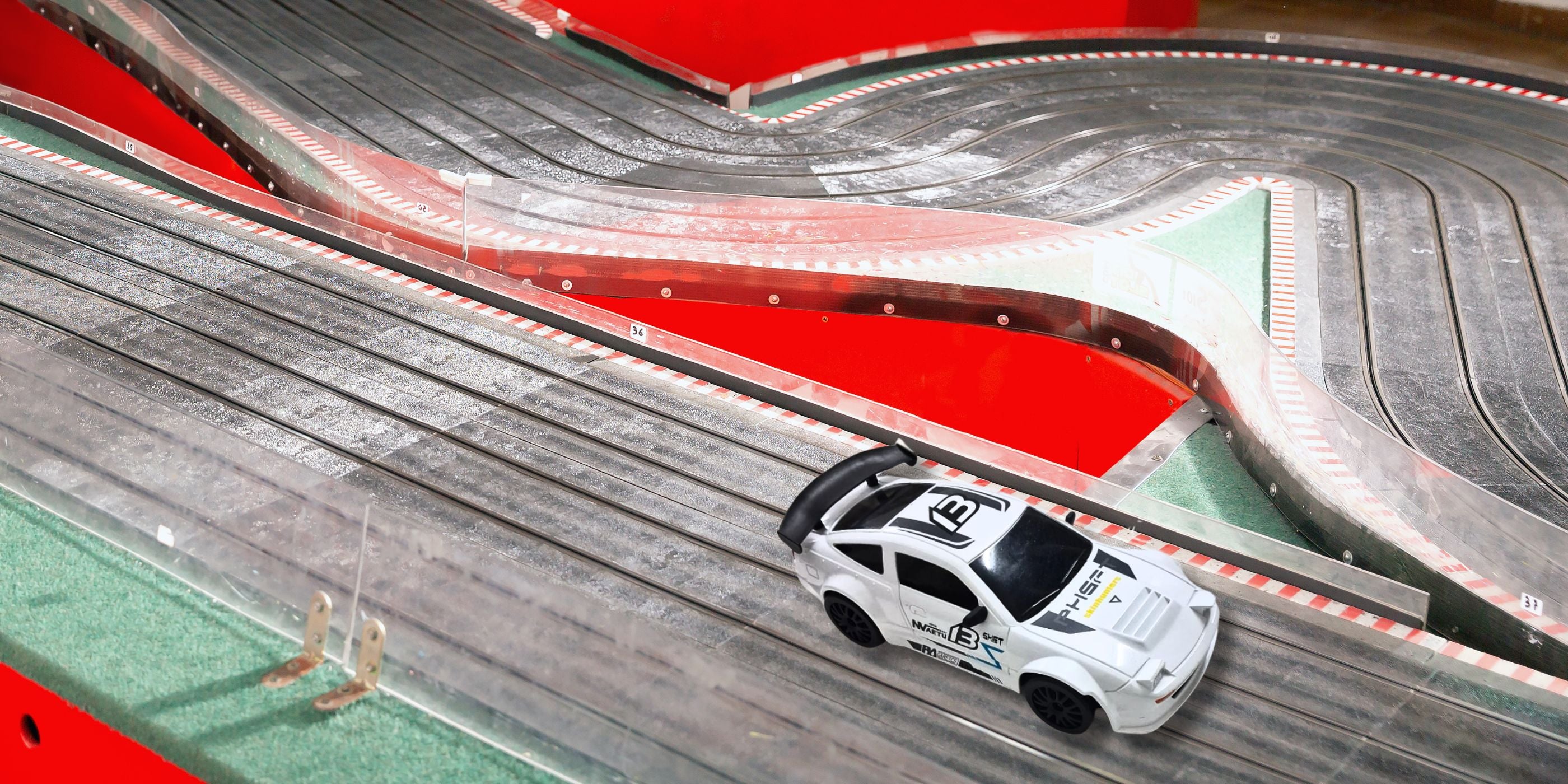 L.O.T Cars Flare (Track White) RC Drift Car driving through a race track