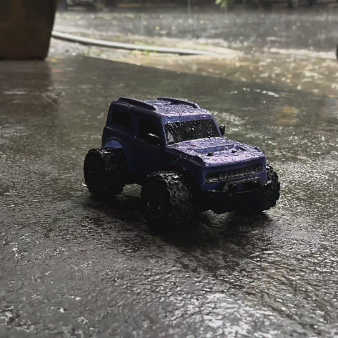 video Showcasing blue RC car on a rainy day with 'L.O.T Cars' branding